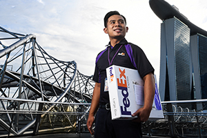 Man carrying a fedex package